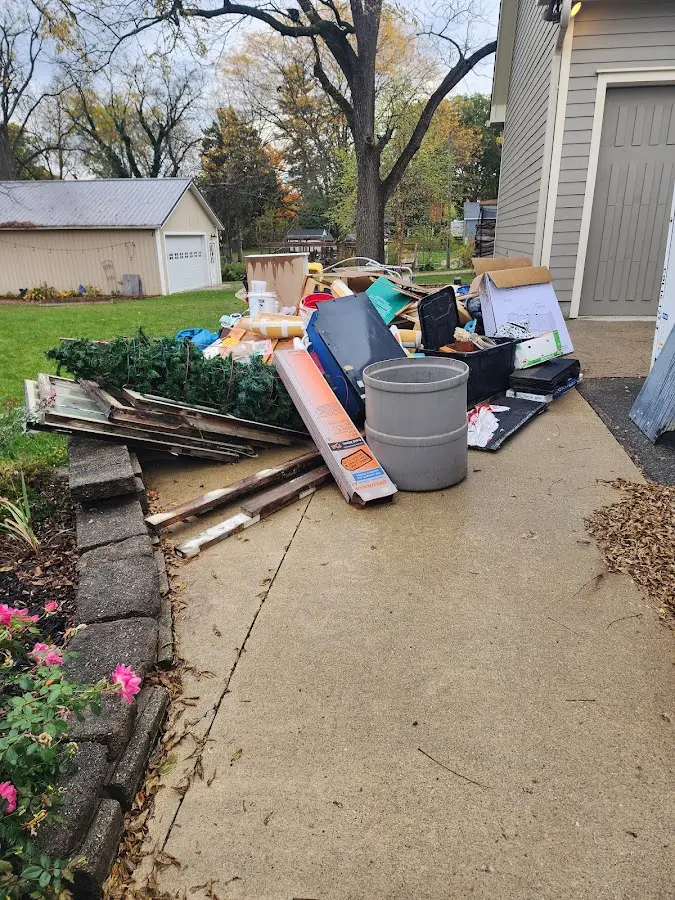 Dumpster being loaded with debris for Residential Dumpster Rental in Texarkana